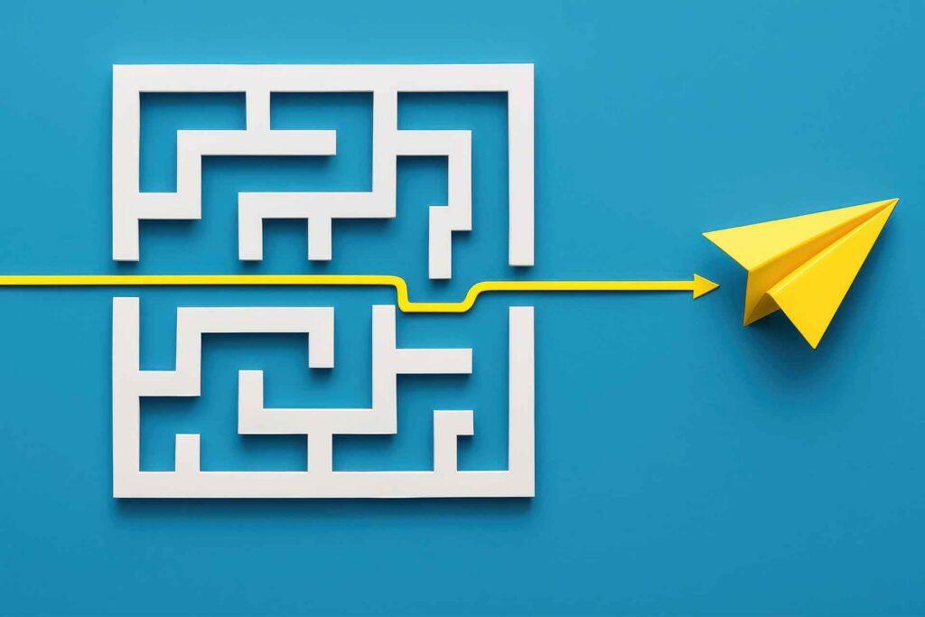 Paper plane flying through maze.