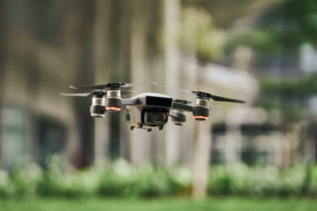 Drone flies in front of building
