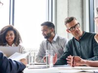 Employees at a legal meeting.